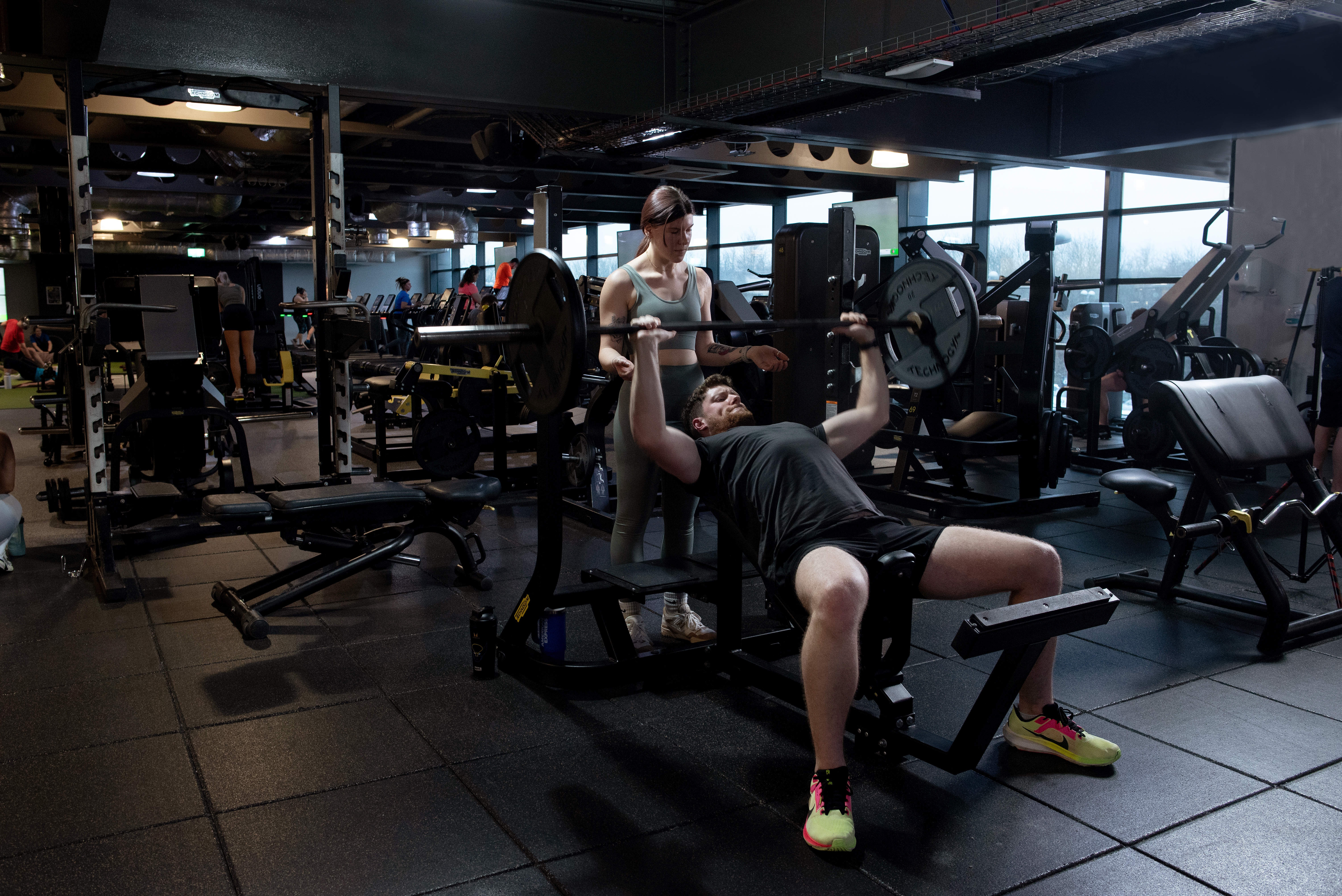 Man on bench press gym