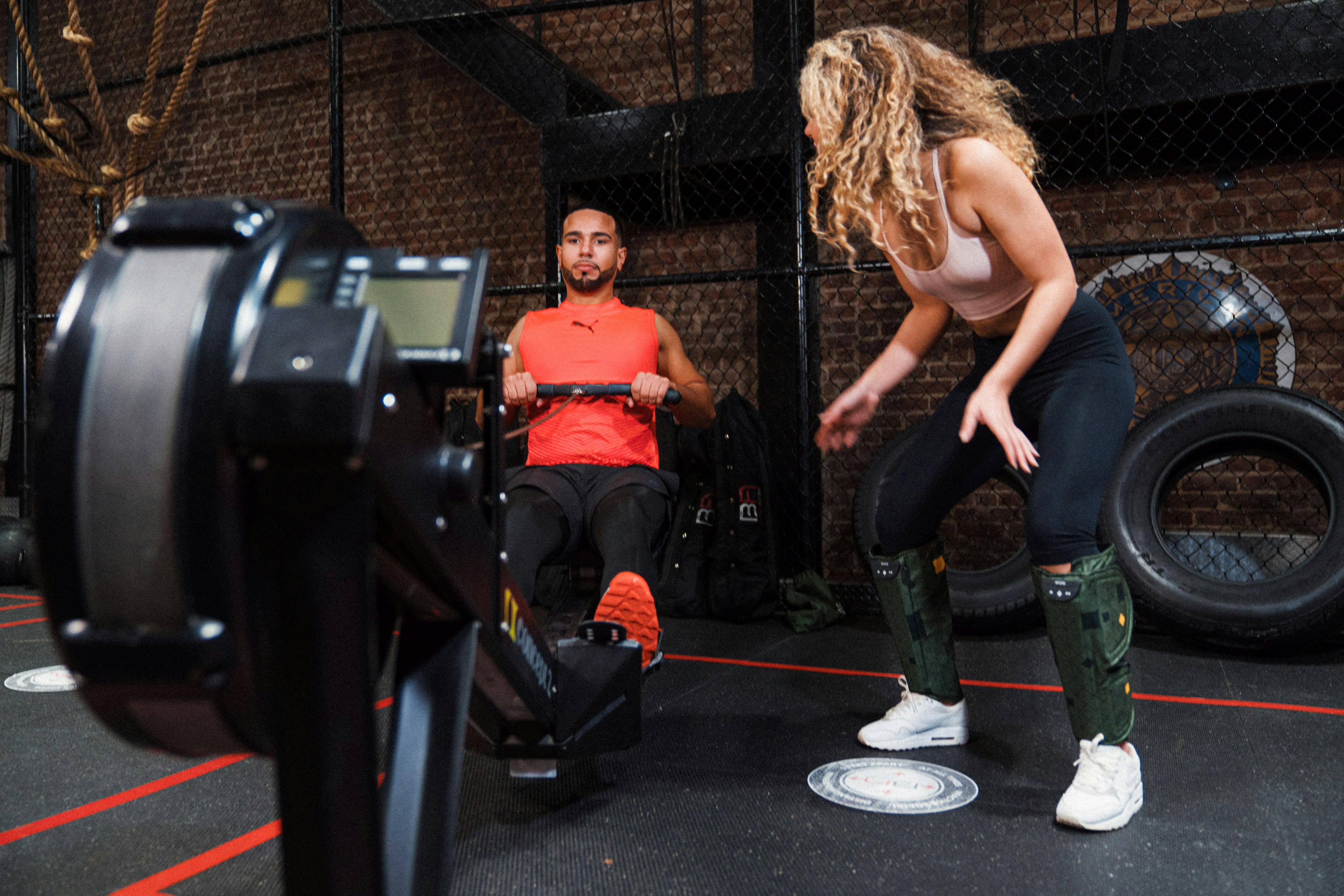 Fit man doing exercises on rowing machine