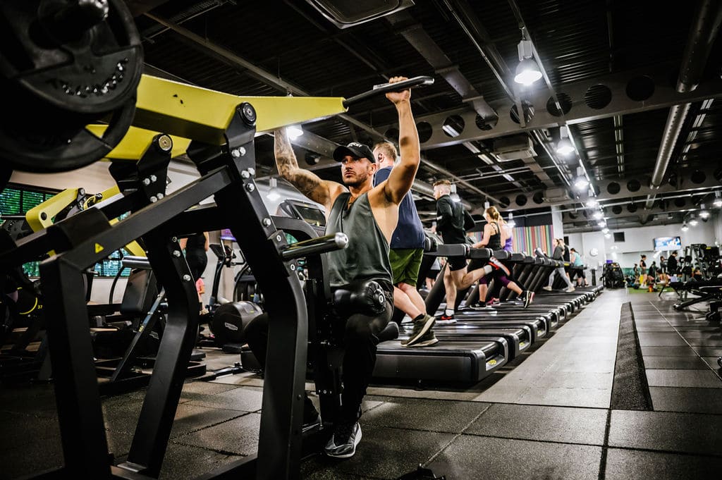 Man on Exercise Bike in Gym