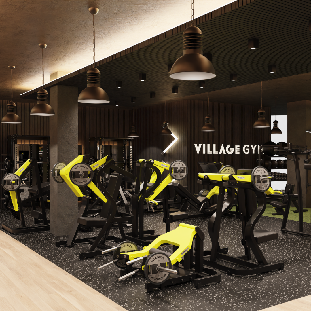 A gym interior featuring yellow and black workout equipment arranged throughout the space.