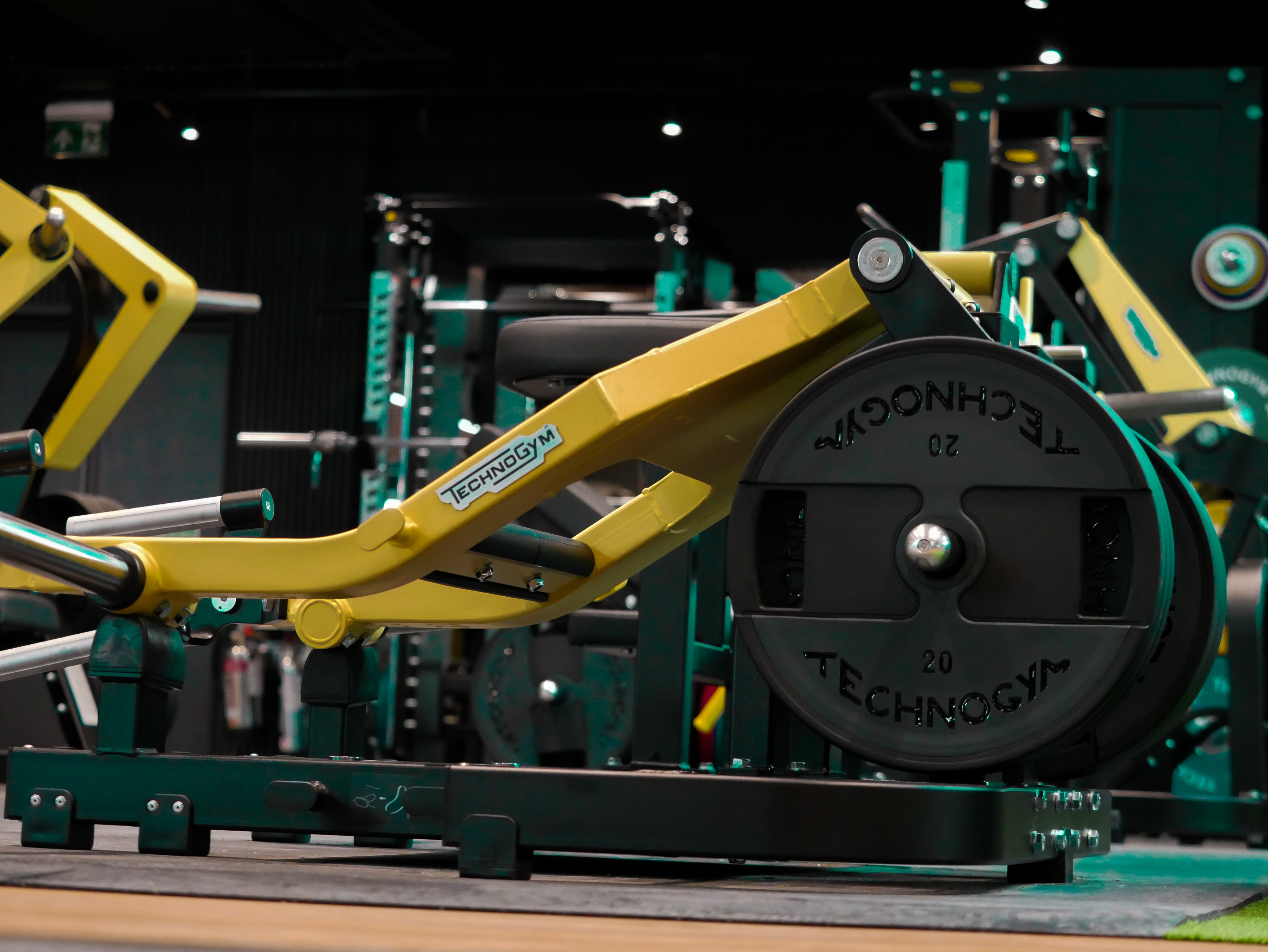 A woman holds a smartphone with a fitness app open