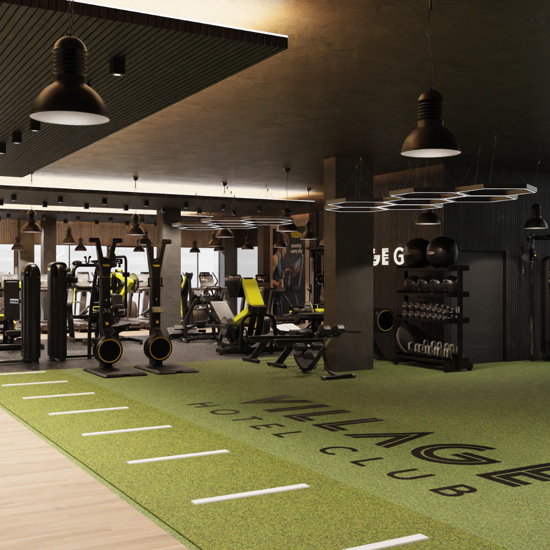 A gym featuring a vibrant green floor and sleek black walls, creating a modern and energetic atmosphere.