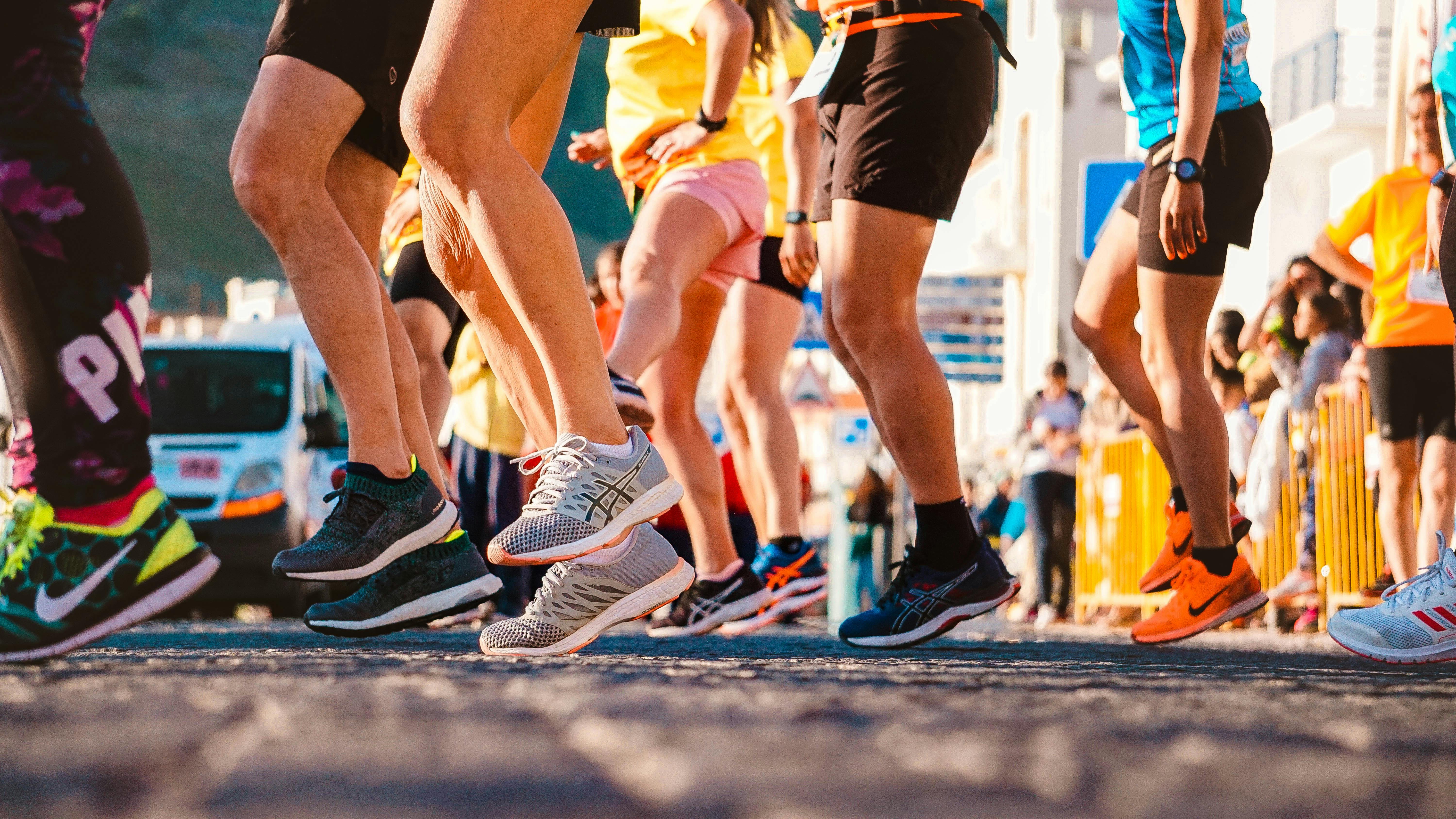 People wearing running shoes at half marathon